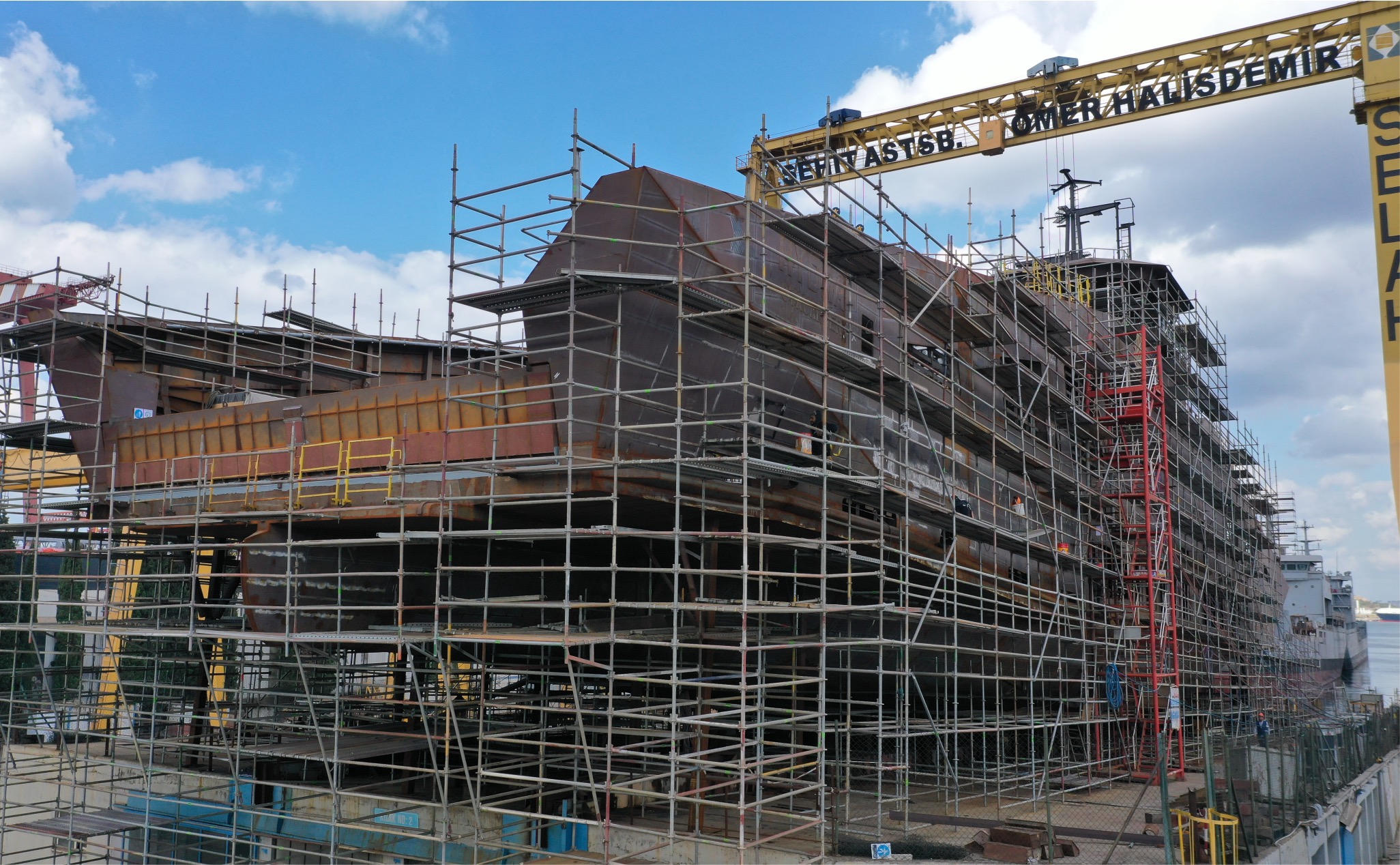Ship under construction wrapped in Özler UNISCAFF shipyard scaffolding
